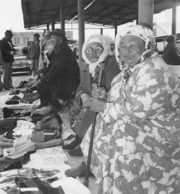 At the weekly bazaar in Nukus, capital of Karakaplakstan in Soviet Central Asia, Aikhan Kulsiyityeva sits on the ground selling children’s clothes. She says people are distracted from environmental concerns by the need simply to survive the economic collapse.