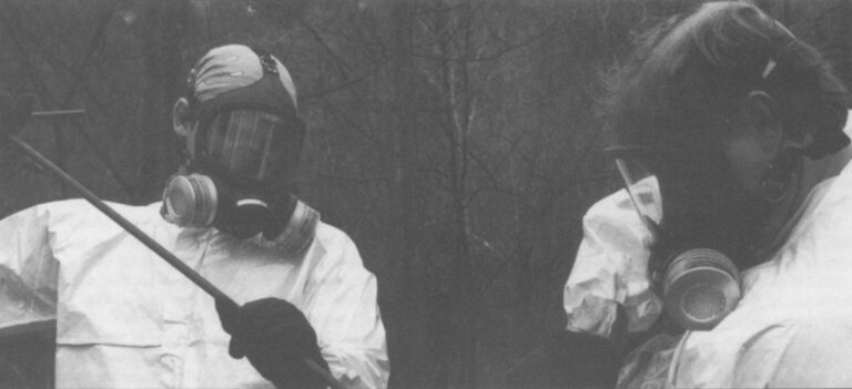 The dioxin contamination of the soil at Times Beach, Missouri required protective gear for EPA officials to take samples. The town ultimately was abandoned by its citizens. Photo: EPA Journal.