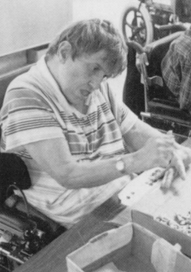 Cathy Stanton, 69, who has severe cerebral palsy, earns only $3 to $12 per month, sorting nuts and bolts at a sheltered workshop. But she fears retirement would force her back to a nursing home, as her Milwaukee group home requires residents to be out of the home during the day. She lived in a nursing home 26 years ago after her grandmother, who had cared for her, became ill. Both women ended up in the same nursing home, Stanton staying there long after her grandmother died.