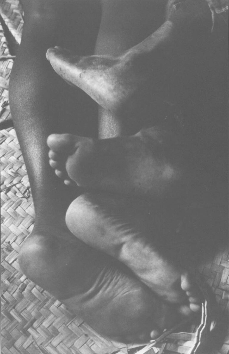 Street orphans sleep on the floor of a former voodoo temple, intertwined like kittens.