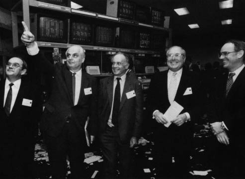 The eastern block nations desperately need help from western markets. This 1990 visit to Philadelphia Stock Exchange involved Hungarian Parliament member Marton Tardos (center), and, from left, Grzegorz Wojtowicz, vice president of the National Bank of Poland, Soviet economist Stanislav Menshikov, Philadelphia Stock Exchange President Nicholas Giordano and SEC Chairman Richard Breeden. Photo by AP Wide World Photos.
