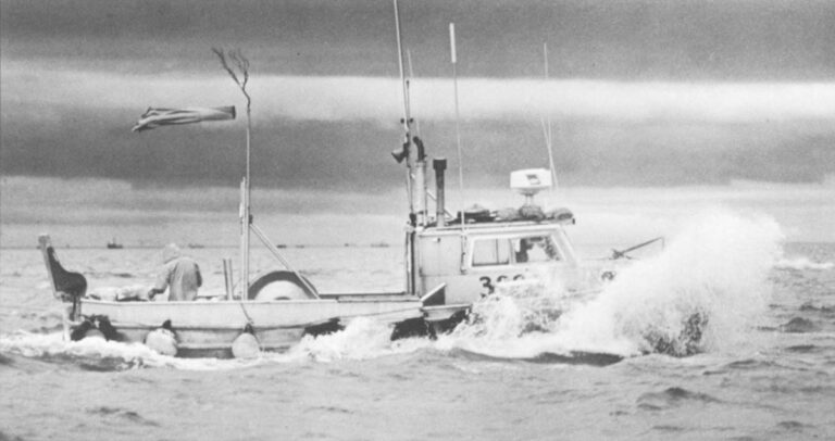 A Bristol Bay gillnetter charges through the chop after an all-night fishing opener.