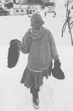 Vera Douglas carries supper home.