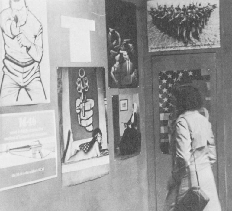 At the ICA Gallery: Poster at lower left reiterates consumer motif of the protest posters. It reads: "M-16 — most reliable destructive method of human extermination. The M-16 is the soldier’s friend."