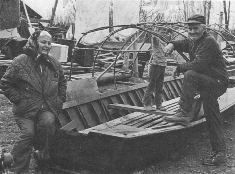 After the Flood Scare – Bessie Wholecheese and Edgar Noliner relax after an orderly break-up of the Yukon River this spring. Noliner had prepared four rafts and built a house on oil drums in case high water threatened the village again.