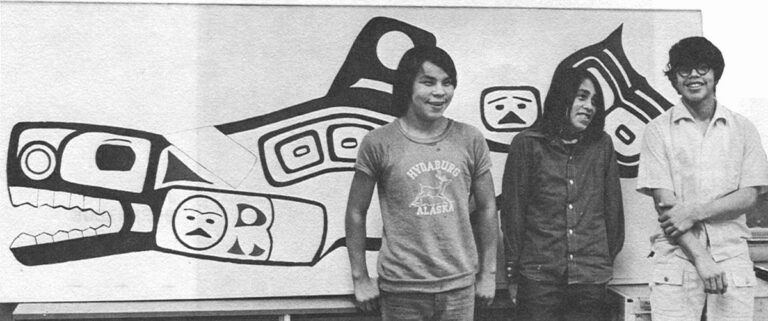 Angoon youths pose with the Killer Whale tribal sign they painted in school.