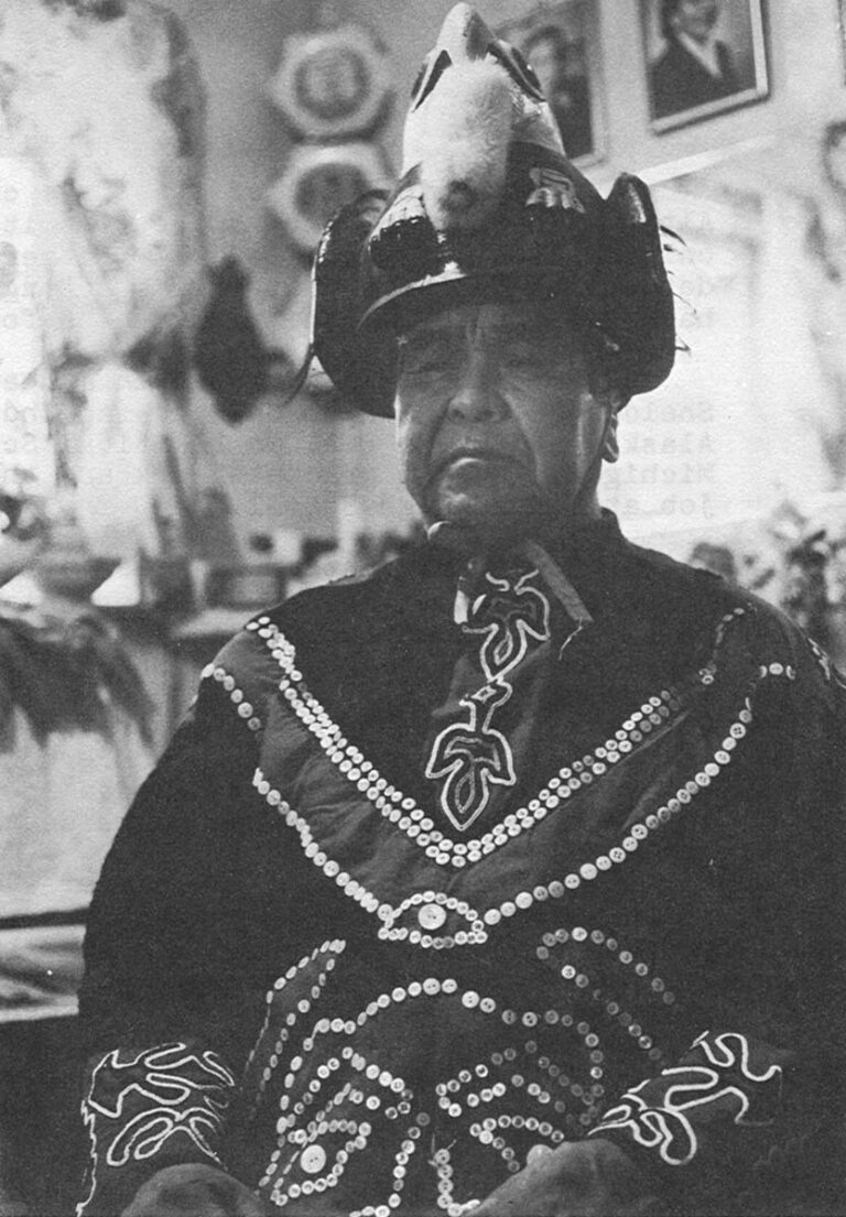 William Nelson Sr. sits for his picture in traditional costume.