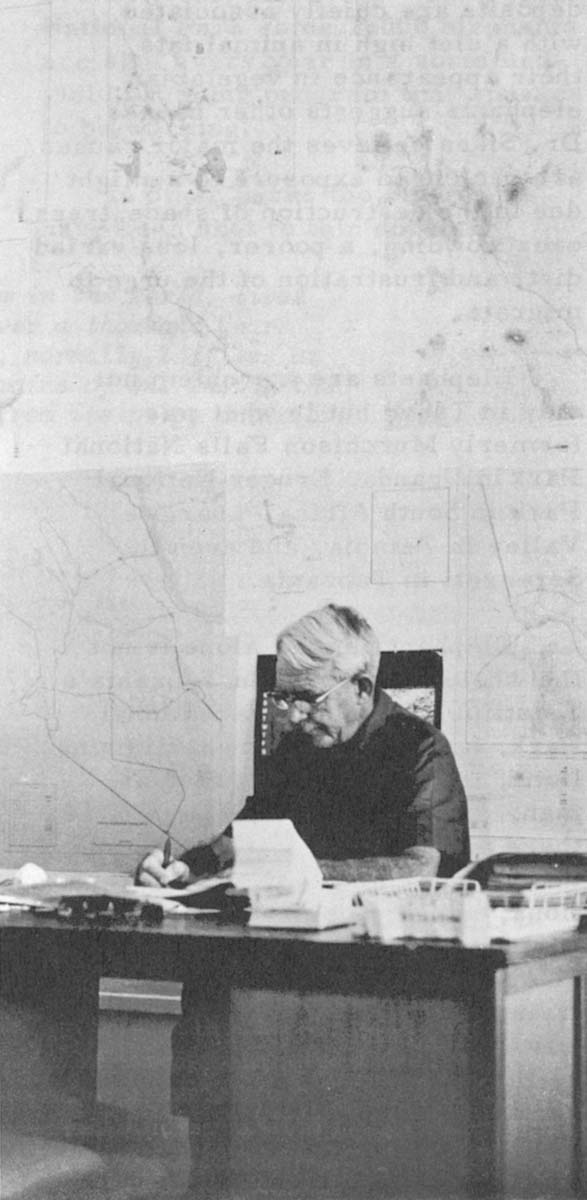 The Tsavo Research Project's second and present director Dr. Philip E. Glover, a botanist, works at his desk. His predecessor, Dr. Richard Laws, recognized as one of the top large-mammal zoologists, resigned after his proposal to shoot 3,000 elephants for research brought horrified protests from traditional conservationists around the world.
