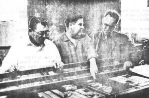 An Early Tour – Howard Rock, left, and Tom Snapp, center, show a visitor through their first printing plant. Actually, it wasn't their plant. They farmed out the job of printing and layout. But the printing plant was decidedly more impressive than their cramped office.