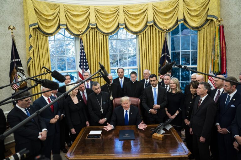 President Trump signing the Iraq and Syria Genocide Relief and Accountability Act of 2018 in the Oval Office. Eight days later, in a surprise announcement, he tweeted his decision to bring all American troops home from Syria. Getty Images