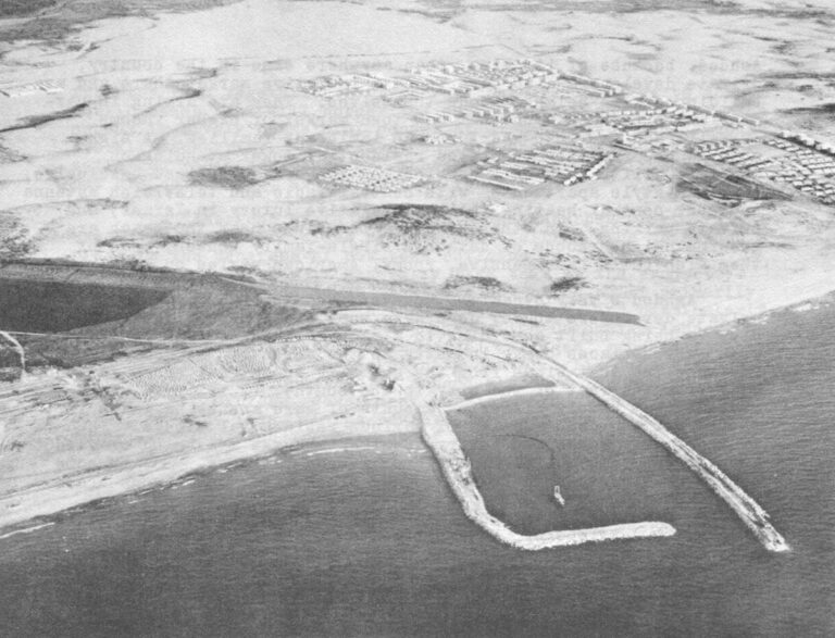 ASHDOD, in 1963 - Construction on the new port and town on what had been empty sand dunes. The beginning of its great arcing breakwater can be seen in the lower right. (The smaller, L-shaped breakwater in center is for construction purposes only.) (Israeli government photo)