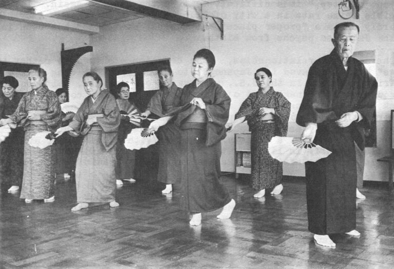 Mrs. Terada, third from left, front, practices her "democracy," a fan dance called Shigesa-Bushi, at the Chichibu Ondo social club for the elderly in Tokyo.