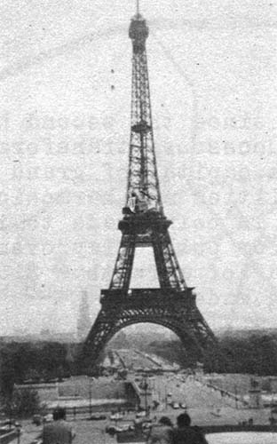 …an apparition behind the Eiffel Tower…