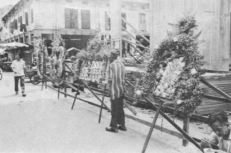 Alongside the death houses or funeral parlors, shops sell necessary accessories including wreaths and coffins.