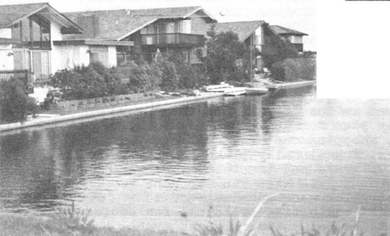 Attractive waterside homes at Foster City, California, "the island of blue lagoons." The houses are yet to be joined by planned industry, shopping and town center that were to be built long ago in this attractive but incomplete and financially ailing new town project.