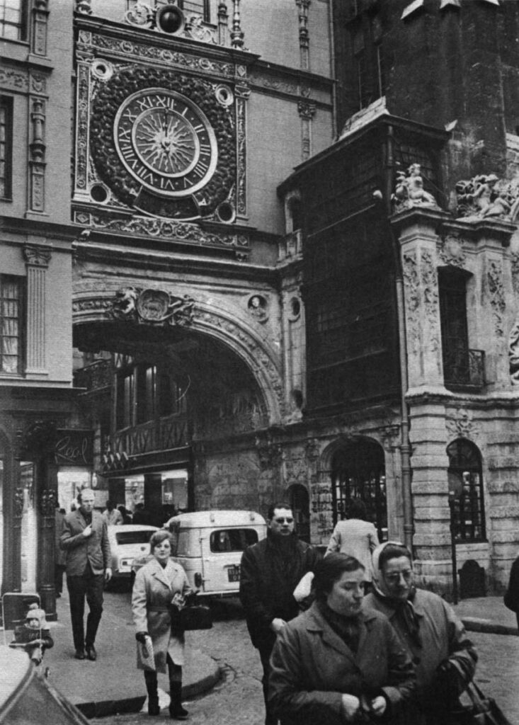 This is the gross clock of Rue du Gros-Horloge. It is the central feature of Rouen's oldest, liveliest quarter. Here modern stores are moving into ancient buildings, gutting them, and rebuilding. The process is far more expensive than building from scratch. The result is also more stylish.