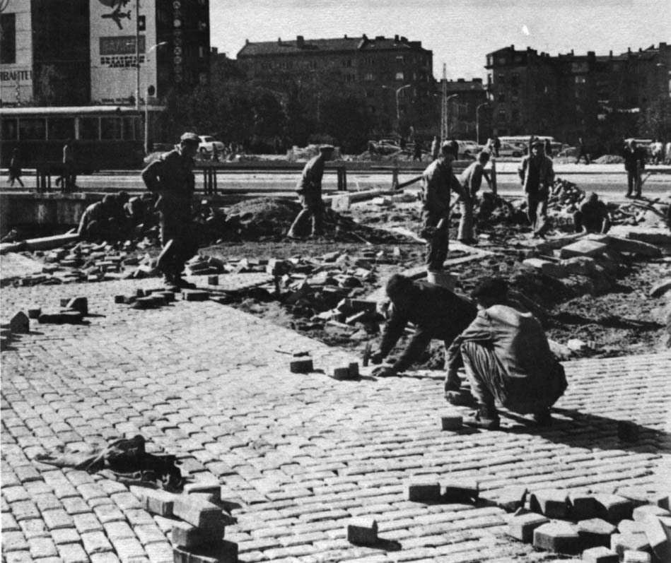 Yellow bricks, used throughout the center of town, are being replaced in the photo to the right.