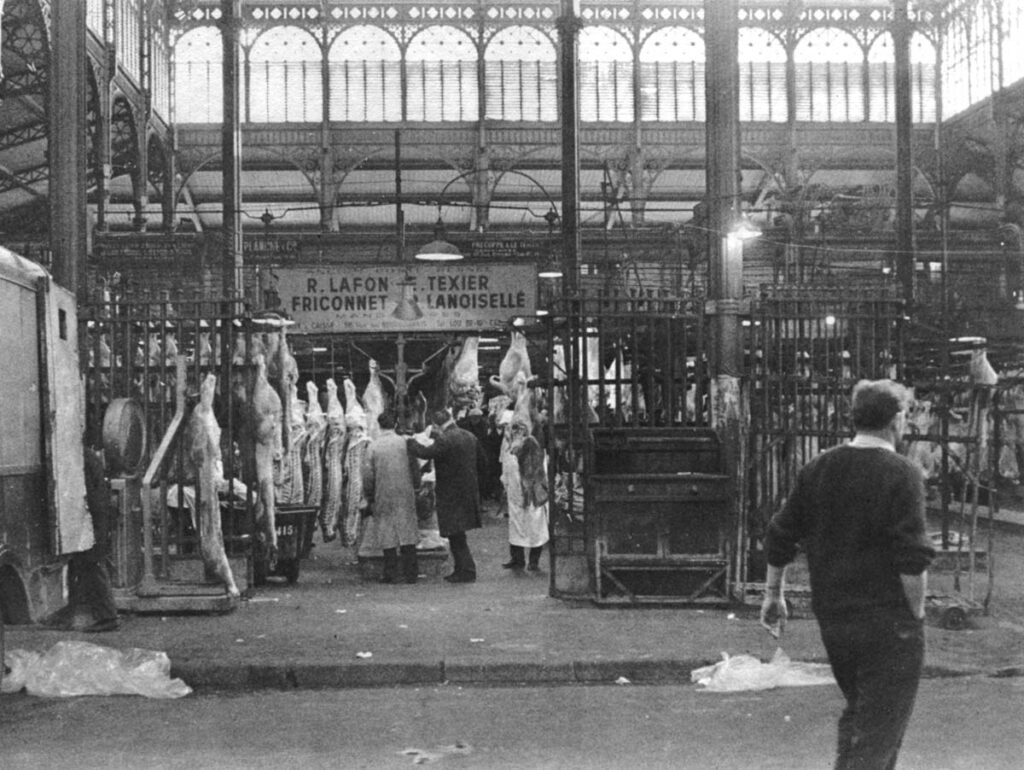 Men bargain in a meat pavilion, one of the last still in use at Les Halles.