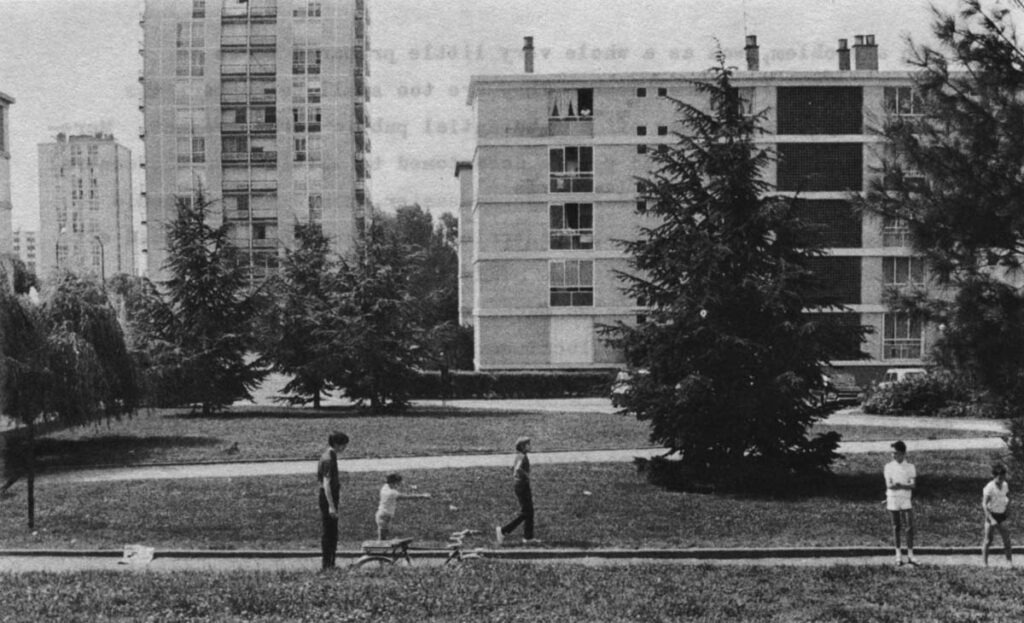 Boys pitching boules in the Sarcelles central park on a Sunday.