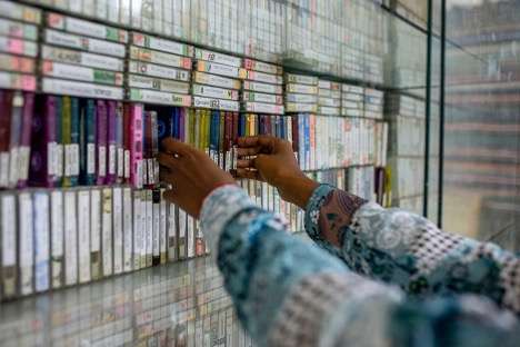 Hafsa Omer working on archiving cassettes at the Hargeysa Cultural Center. (Mustafa Saeed/Noema Magazine)