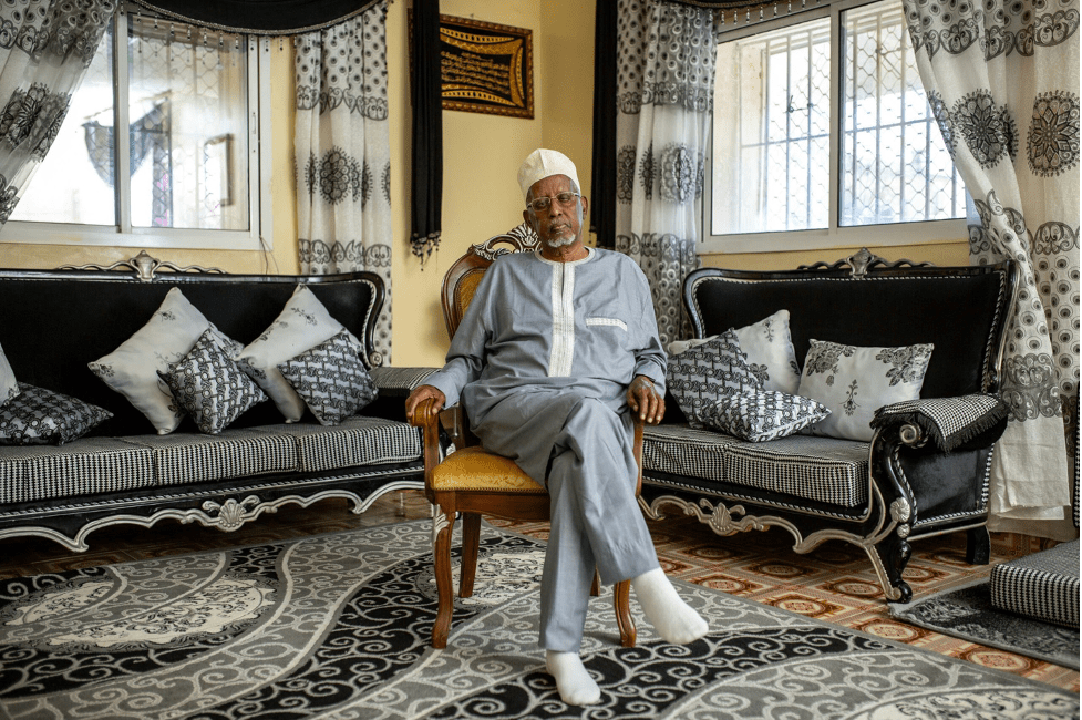 Abdirahman Yusuf Ducaale in his living room in his house in Hargeysa, Somaliland. (Mustafa Saeed/Noema Magazine)