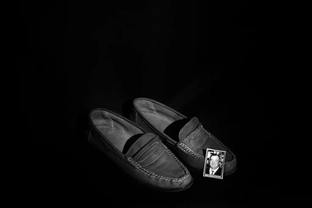 The shoes of Halim Qerkezi, who was born on March 7, 1946. (Diana Markosian for The Washington Post)