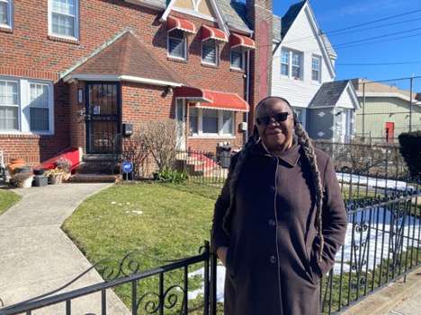 Elizabeth Blaney in front of her St. Albans home. She’s lived in the neighborhood since the 1970s. (Roxanne Scott photos)